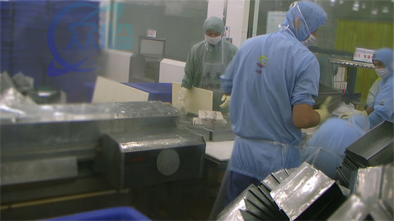 Separate tray machine Fish and shrimp frozen tray isolated in seafood processing factory